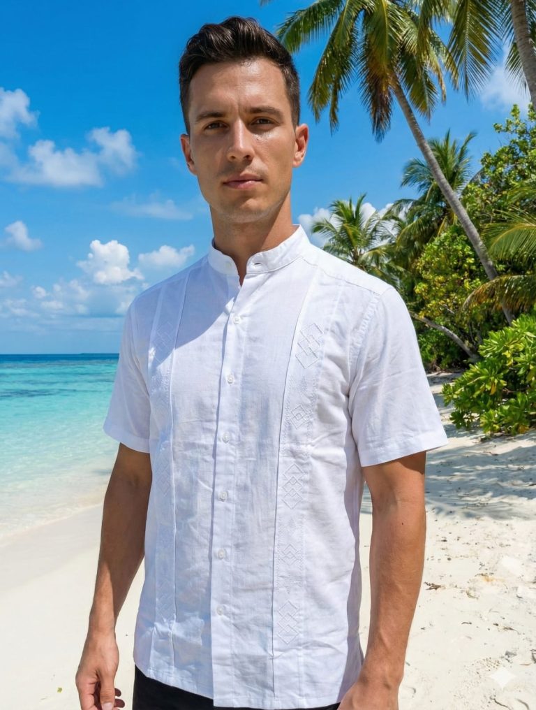 Eleva tu estilo este verano con nuestra exclusiva guayabera blanca, una prenda donde la tradición se encuentra con la sofisticación moderna. Diseñada pensando en el hombre que no sacrifica la comodidad por la elegancia, esta camisa es el complemento perfecto para una boda en la playa, una cena al atardecer o un paseo por el malecón.